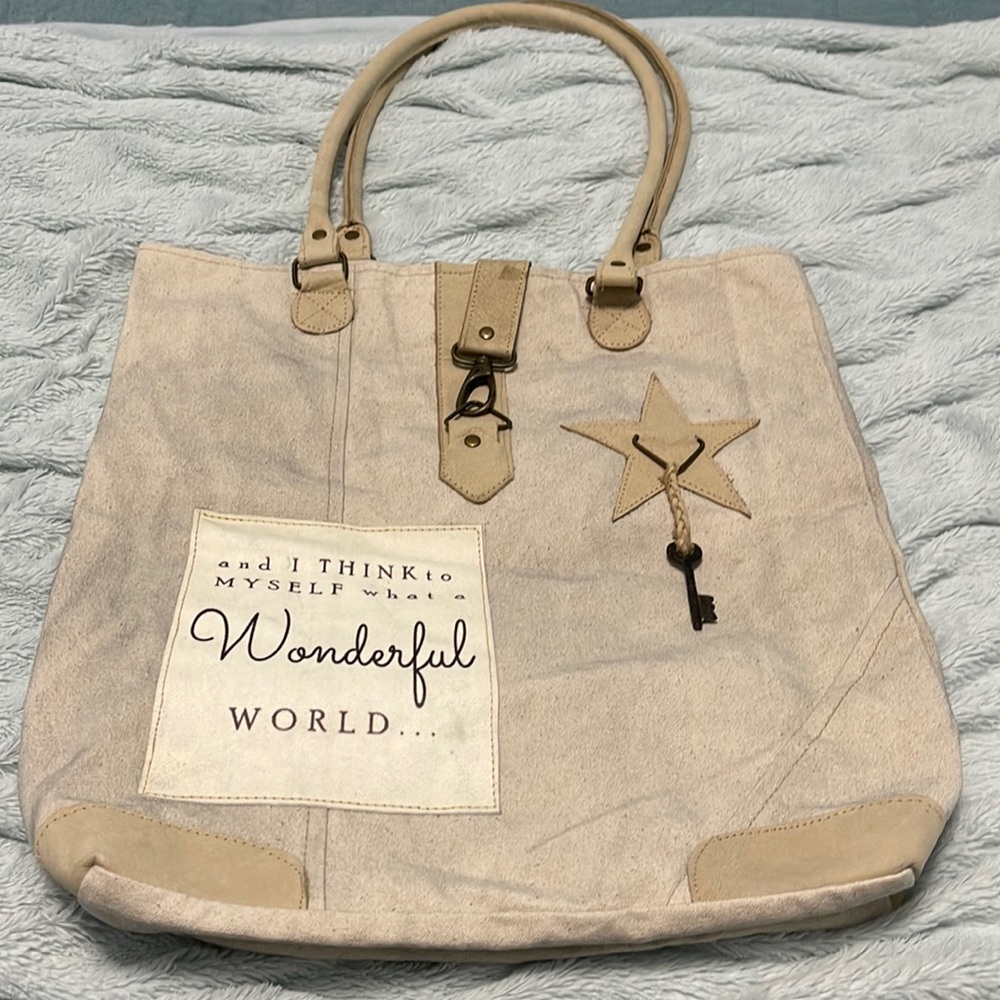 Distressed tote bag with clasp closure. New without tags.
